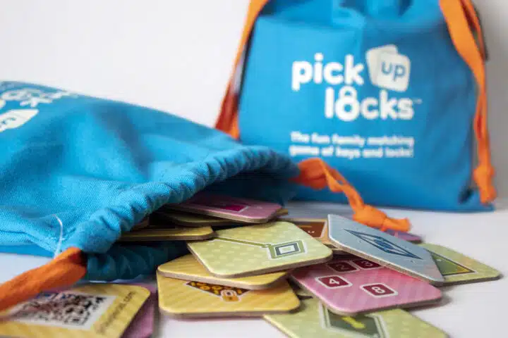 Scattered Pick Up Locks An open bag of Pick Up Locks with tiles scattered out of it and another bag in the background.
