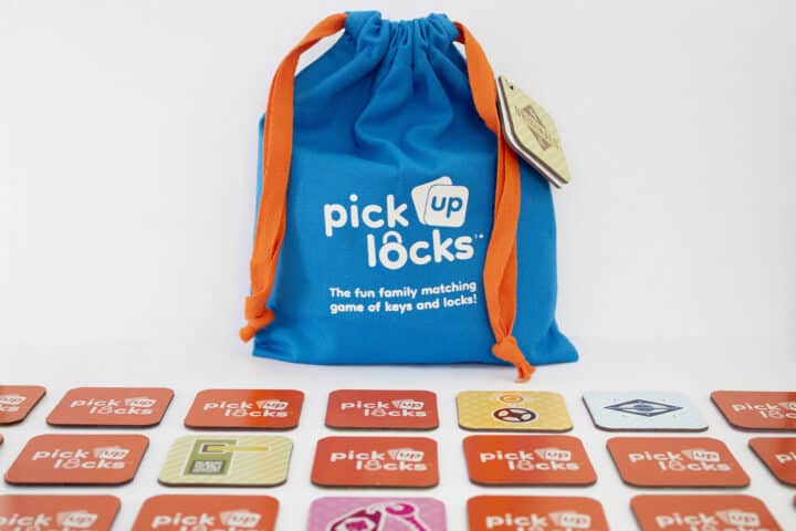 Pick Up Locks Tiles A bag of Pick Up Locks with tiles arranged in a grid in front of it.