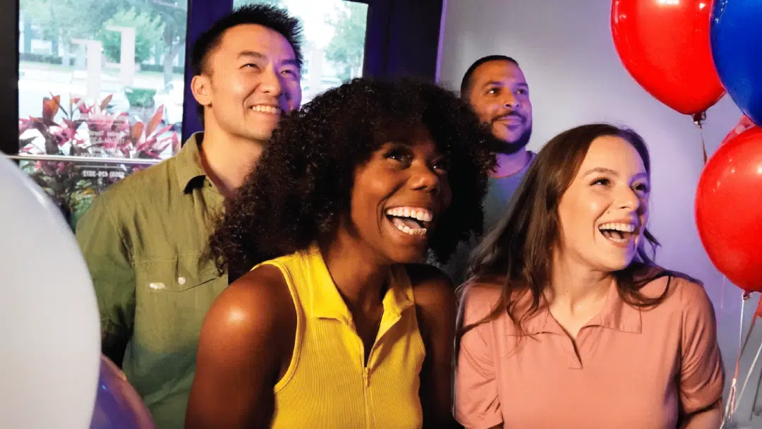 Celebration At The Escape Effect Four friends surrounded by balloons, check in to The Escape Effect and get ready for their game.