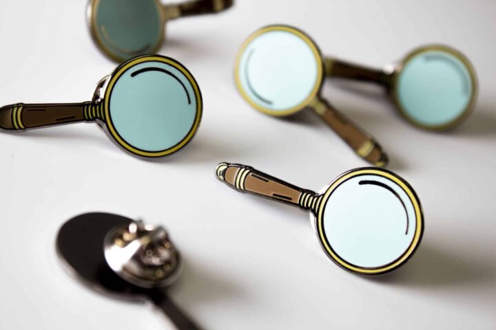 Sherlock Studies Game Pins Grouping of Sherlock Studies Magnifying Glass pins.