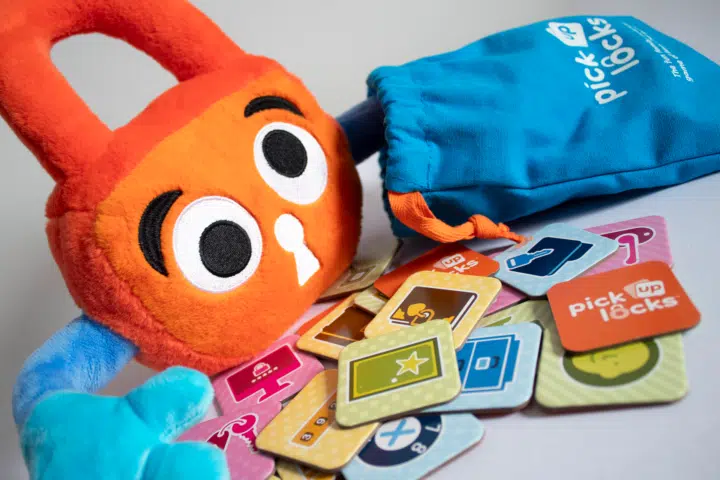 Picking Out A Tile Paddy puts her hand in a bag of Pick Up Locks, to pick out a tile.