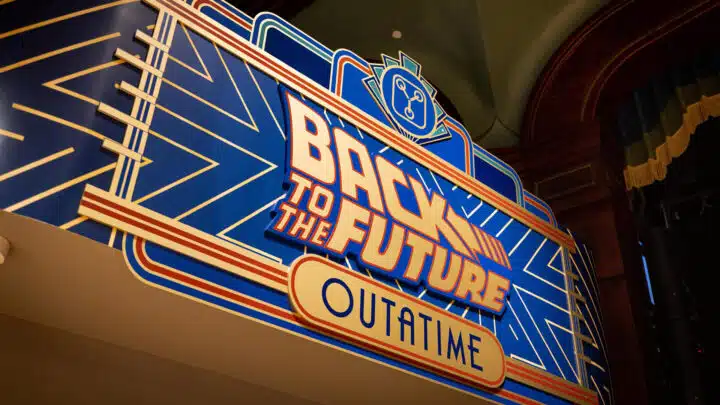 Promotional image for Universal's Great Movie Escape, featuring the sign for the Back To The Future room.