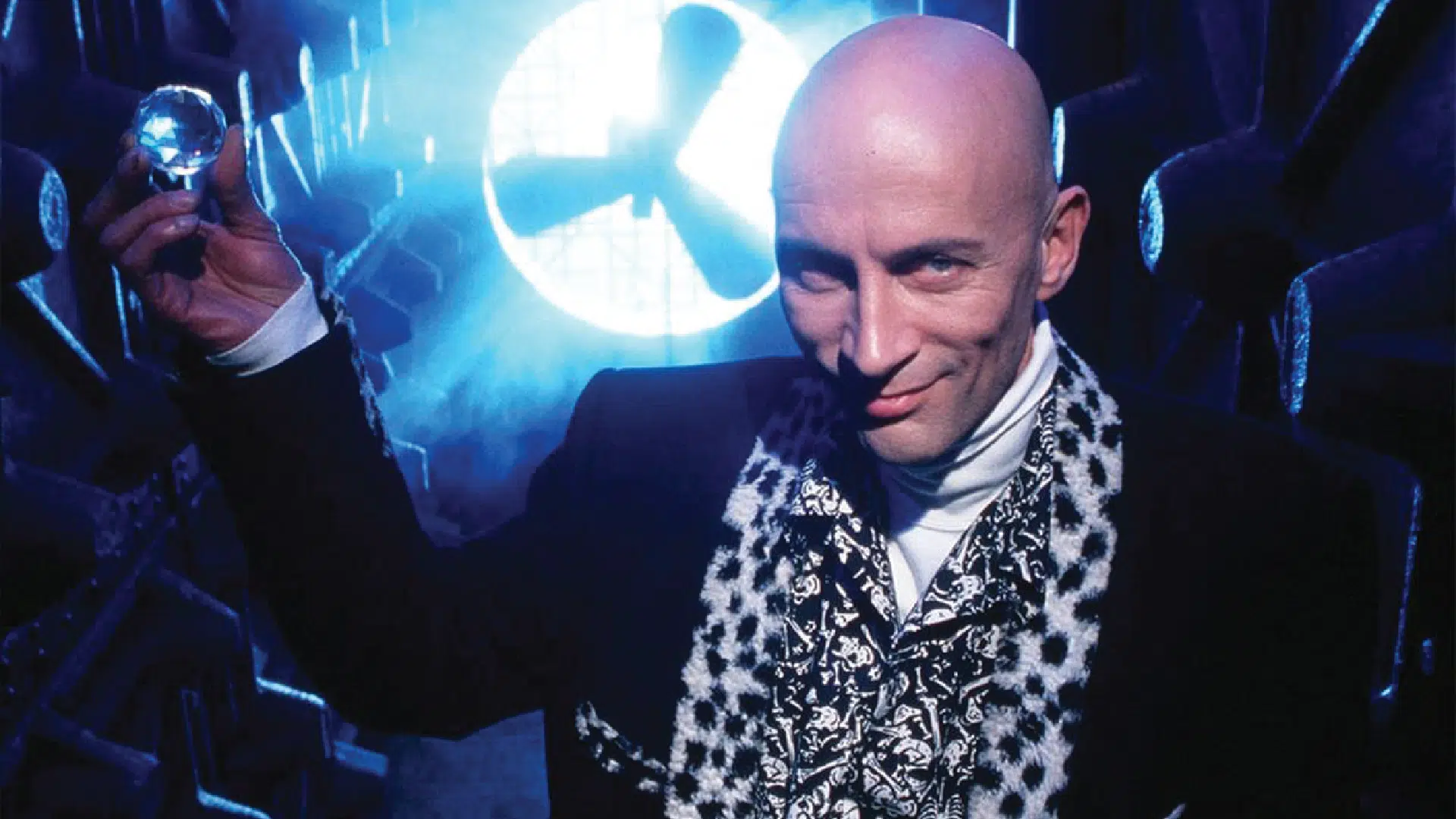 Richard holds up a time crystal, used to earn time within the Crystal Maze.