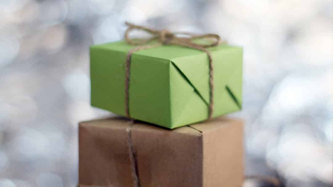 A green gift box stacked on top of a brown gift box, representing Father's Day gifts.