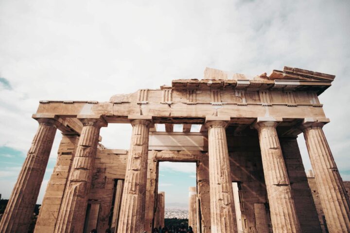 Ruins of a Greek structure, held up by round columns.
