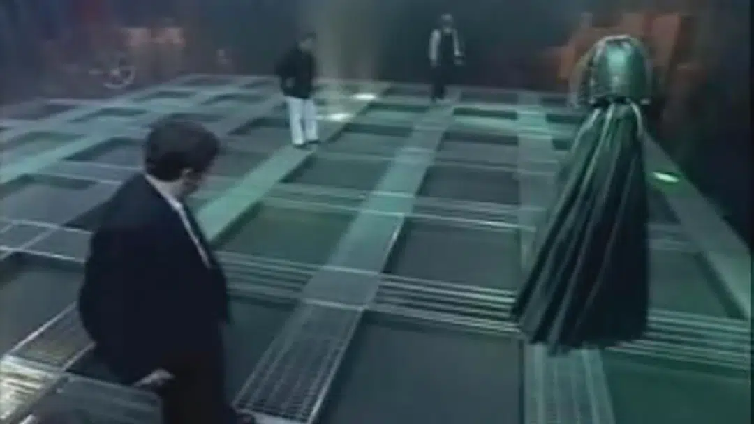 The Dark Knight approaches contestants on a game show.