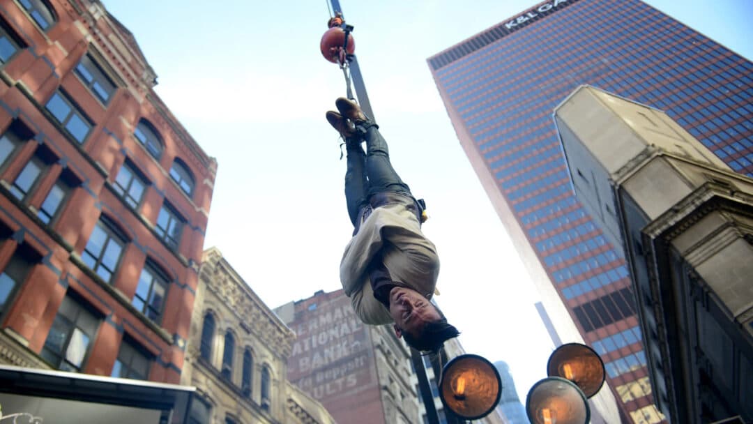 Magician Lee Terbosic recreates Harry Houdini's straight jacket escape.