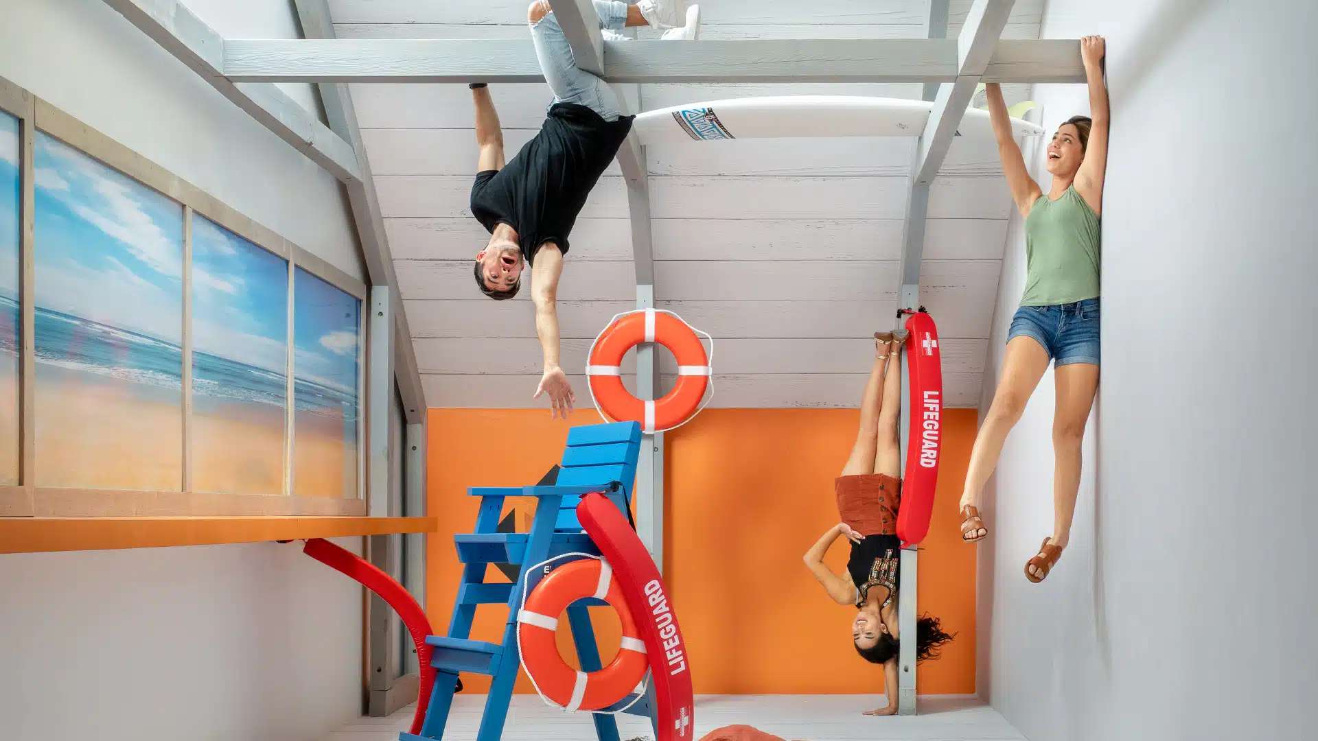 A group standing in the reversed room at Museum of Illusions.