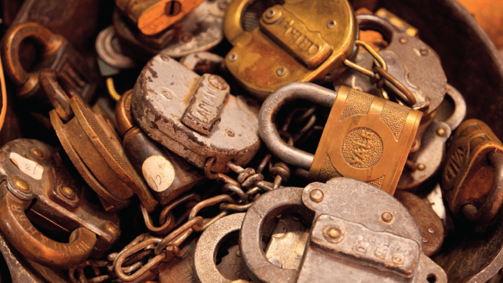 A collection of padlocks and chain.