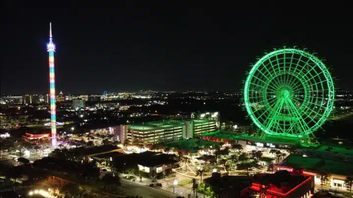 A Ferris wheel and swing ride at an amusement park on International Drive.