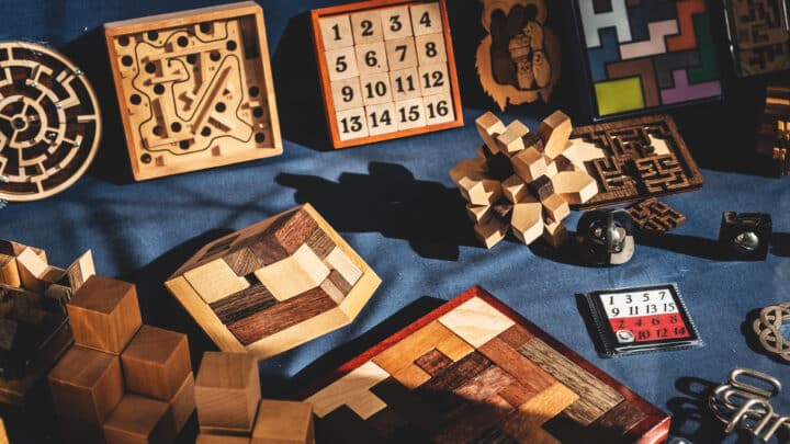 An assortment of wooden puzzles on a table.