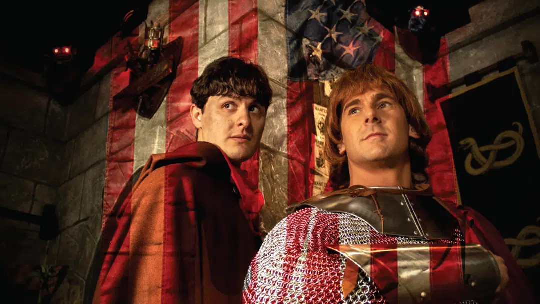 Two brave adventurers against the American flag in A Knight To Escape.