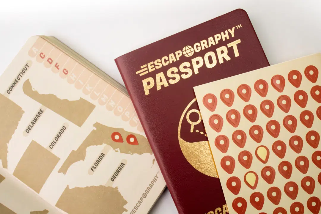 The passport log book, open to a map page with stickers in use.