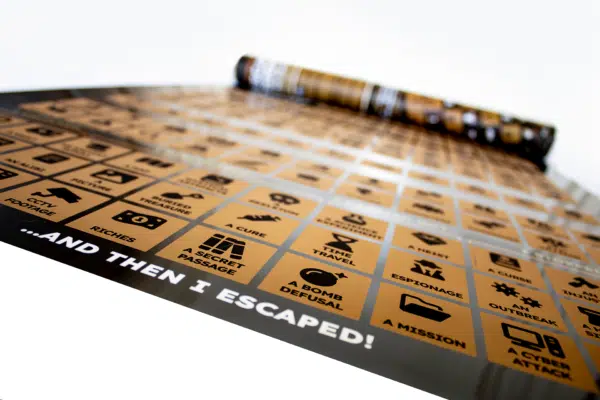 A photograph of an escape room poster, featuring scratch off sections for different themes and situations.