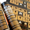 A photograph of an escape room poster, featuring scratch off sections for different themes and situations.