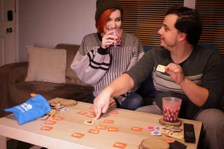 Two adults playing Pick Up Locks.