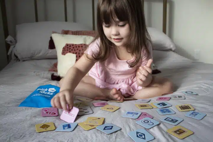 A toddler playing Pick Up Locks.