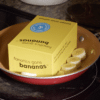 A photo of a Fanatics Gone Bananas box being pan fried along with some banana slices.