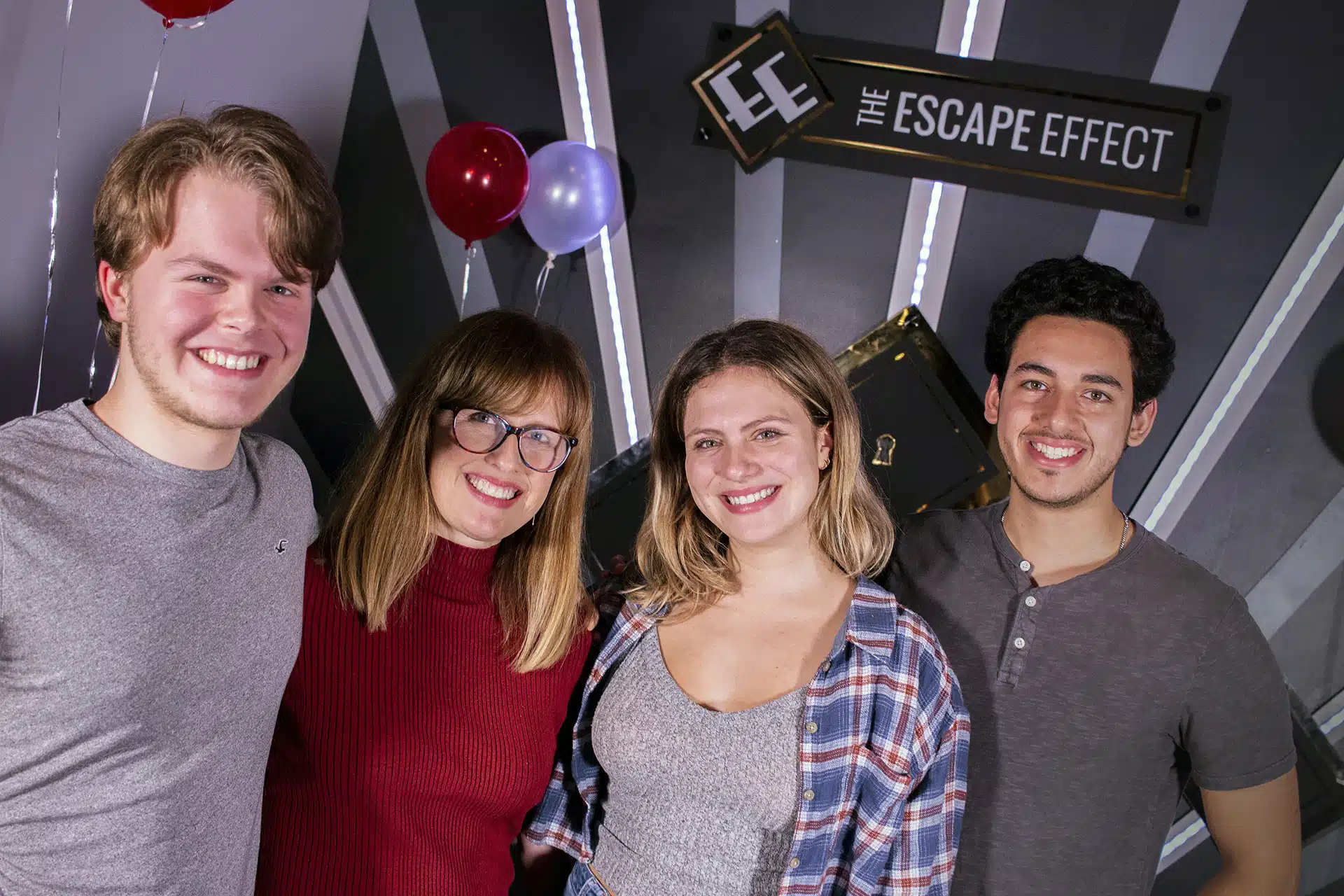 A group of players celebrate at The Escape Effect.