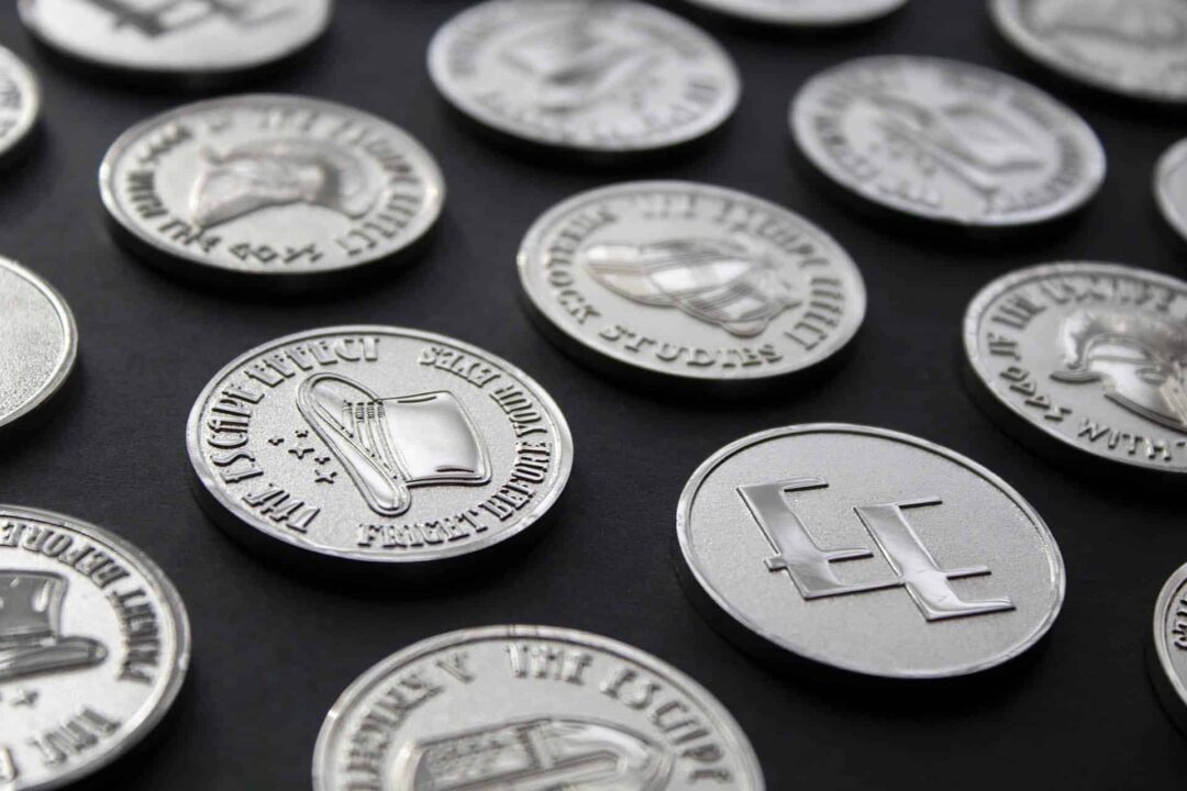 Selection Of Coins From The Escape Effect A photograph showing a selection of collectable coins from The Escape Effect.
