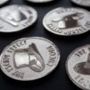 A grouping of coins depicting a top hat.