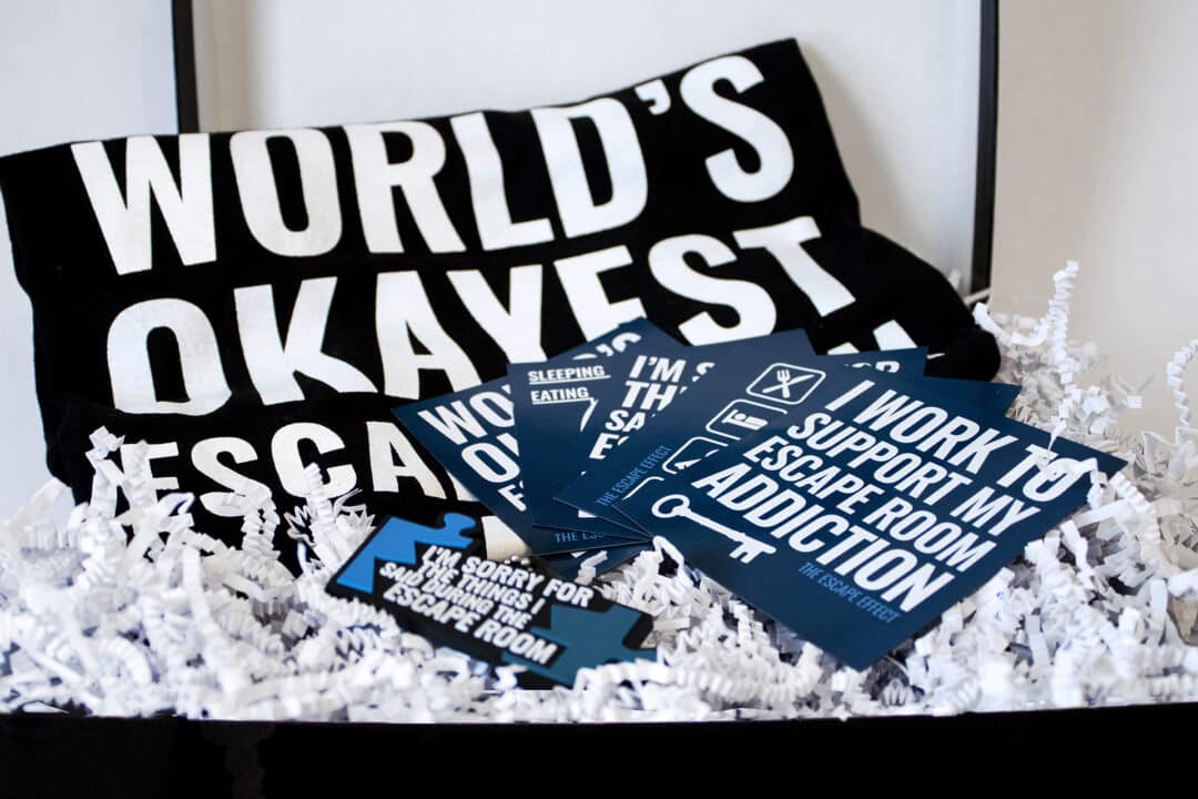 A gift box including magnets, shirt and keychain.