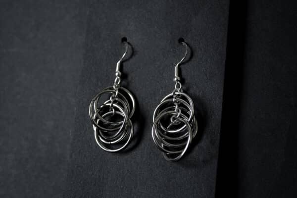 A photograph of a set of chain link earrings.