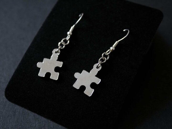 A photograph of a set of puzzle piece earrings.