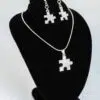 A photograph of puzzle necklace and matching earrings.