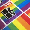 An arrangement of rainbow magnets with a man exiting a door and the phrase 'I'M OUT'.