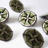 Grouping of Encore Compass pins.