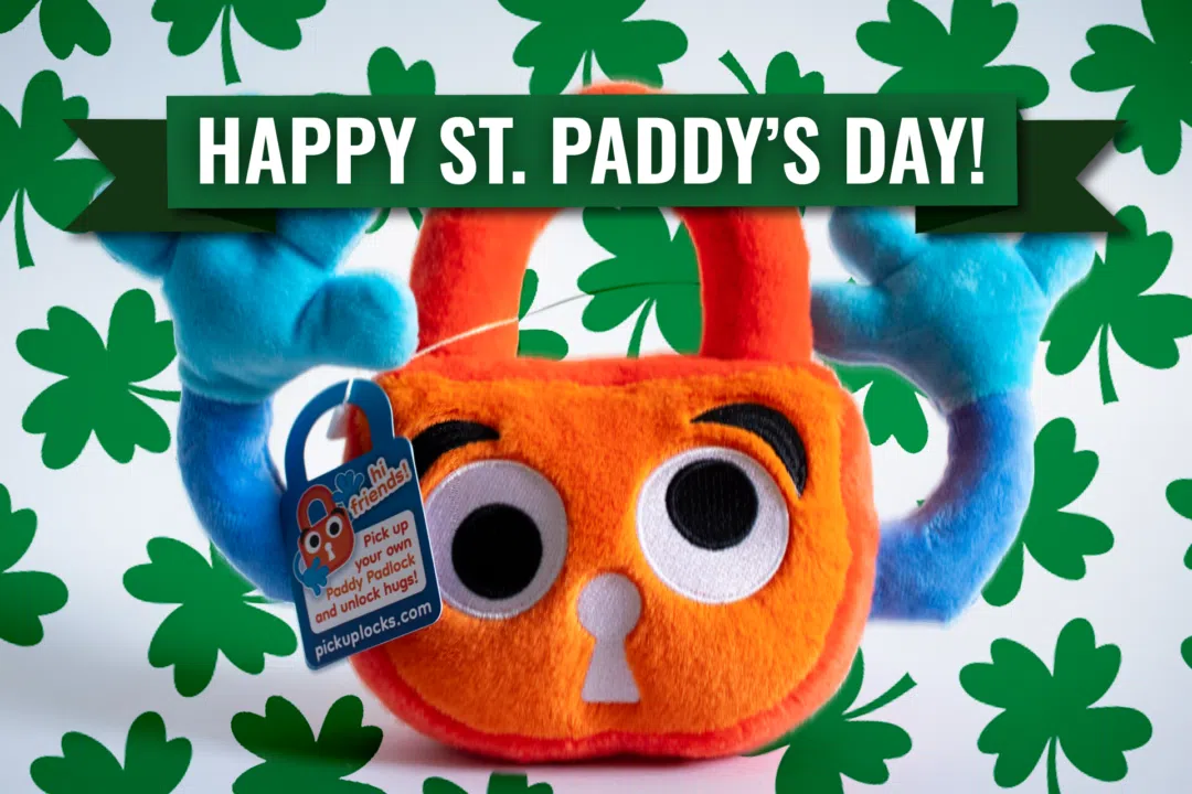 Paddy the Padlock surrounded by clovers and with a Paddy's Day banner.