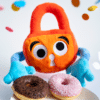 Paddy Padlock offers donuts to friends.