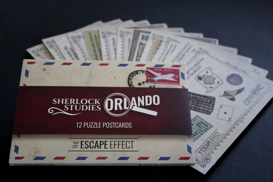 A set of Sherlock-themed puzzle postcards fanned out, with the box in front.