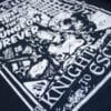 A photo showing a shirt with a design for the A Knight To Escape game.