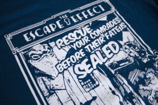 A photo showing a shirt with a design for the A Knight To Escape game.