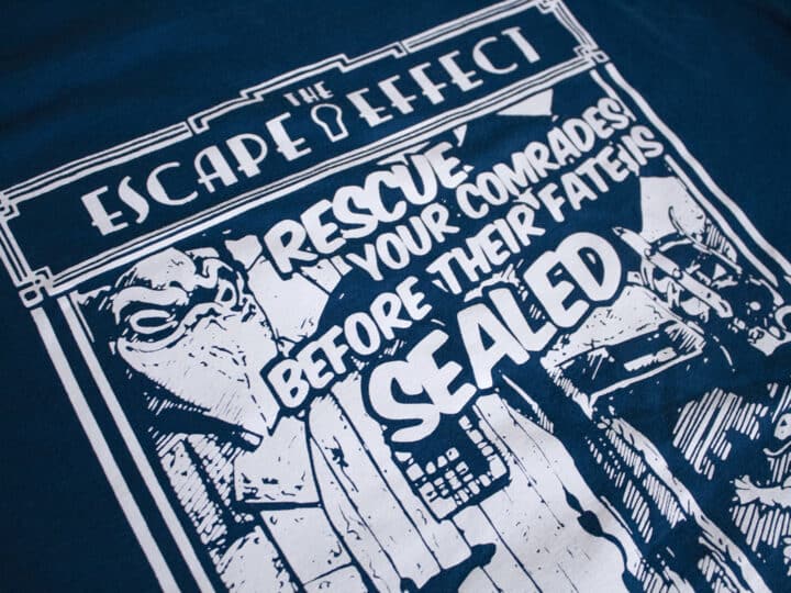 A photo showing a shirt with a design for the A Knight To Escape game.