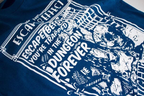 A blue "Knight To Escape" shirt featuring an illustration of a dungeon.