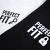 A photography showing two shirts with the phrase Perfect Fit, with an image of a key and padlock.