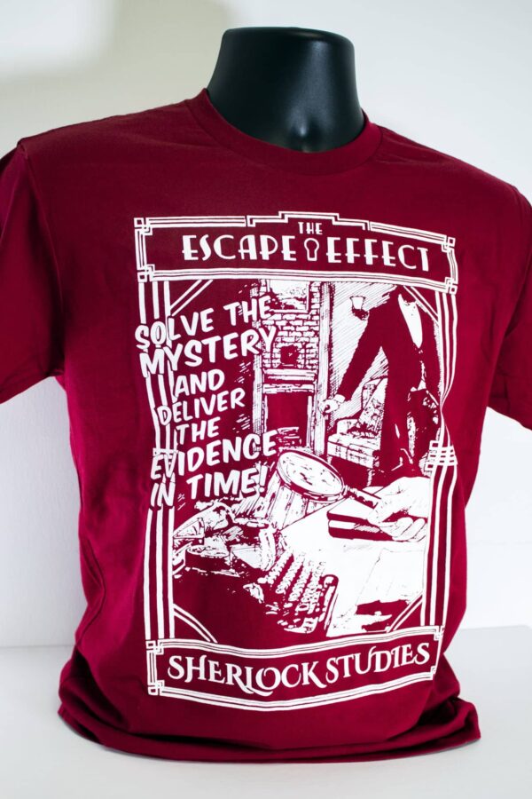 A red "Sherlock Studies" shirt featuring an illustration of detectives inspecting a study.