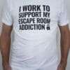 A photo showing a shirt with the phrase I Work To Support My Escape Room Addiction.