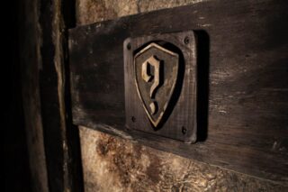 A close up of the hint button, in the shape of a shield.