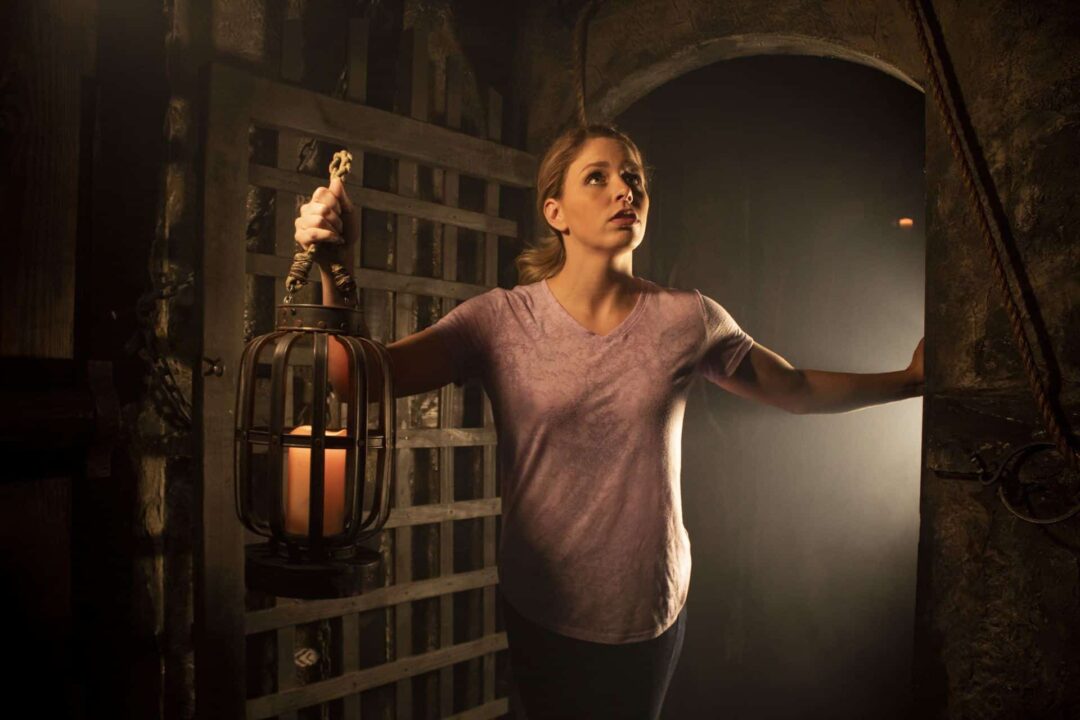 Lost In A Dungeon An escape room player ventures through the dungeon in search of her friends.