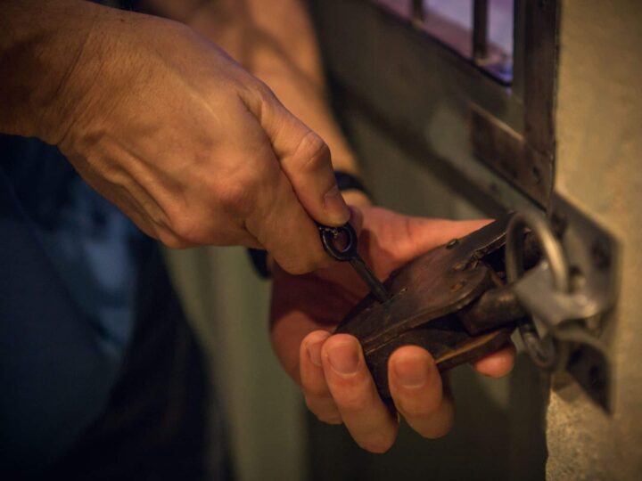 A player unlocking a chamber within the ancient temple in the 90 minute escape room.