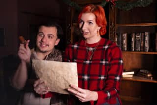 Two enthusiasts look over clues in Sherlock Studies.